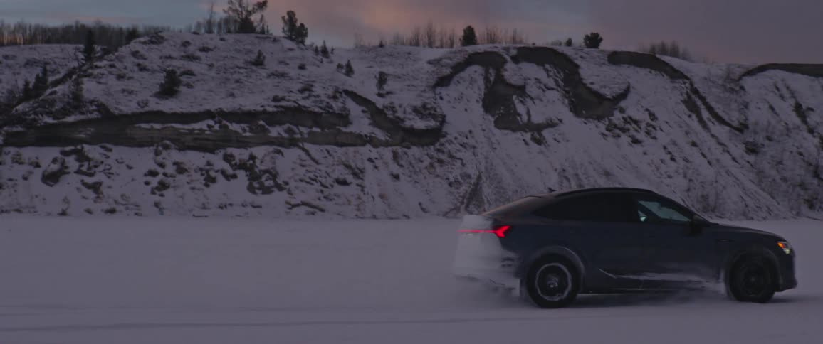 The vehicle is driving in the snow