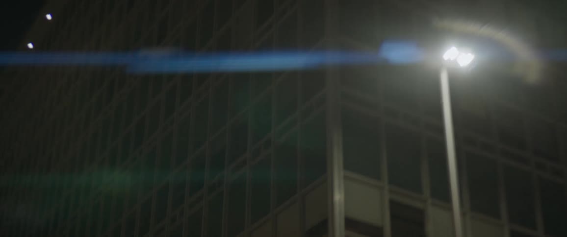 A close up of windows on a high rise building in a city