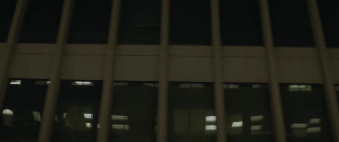 A building in a city is displayed at night