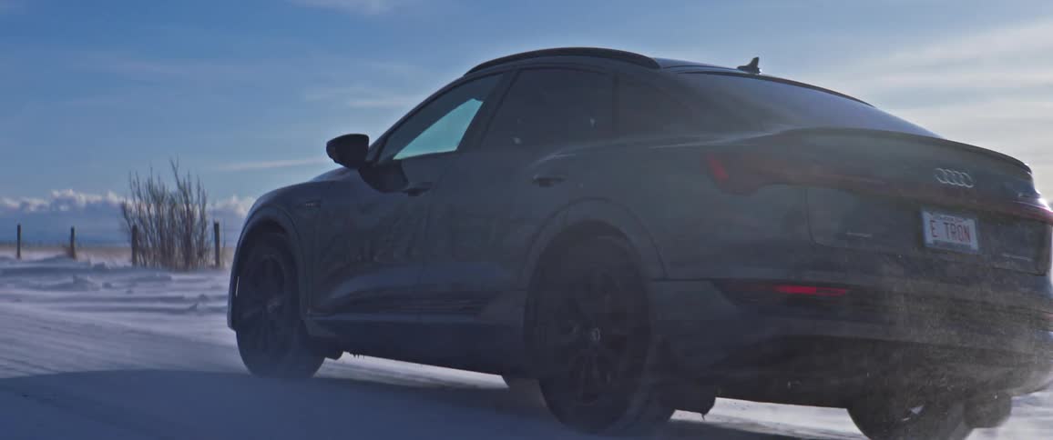 A car driving on a snow covered road