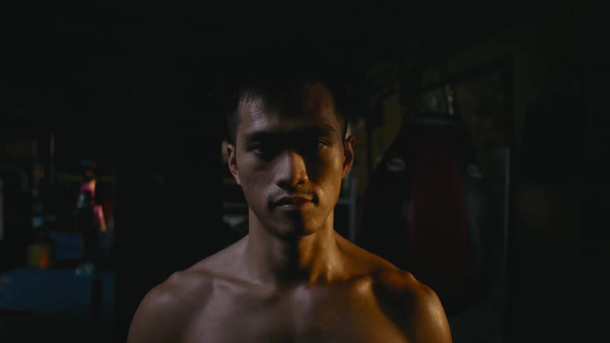 A man is walking through the gym