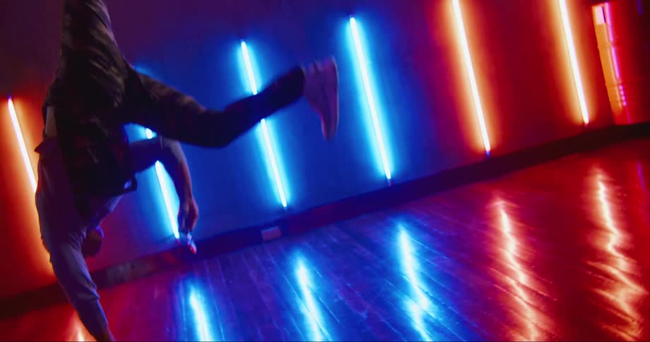 A man flips as he performs a dance routine