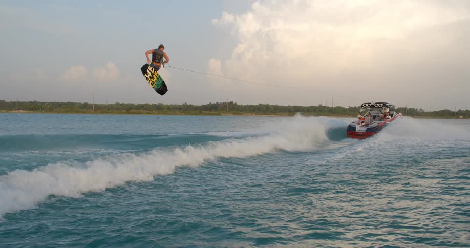 A person wakeboarding behind a boat