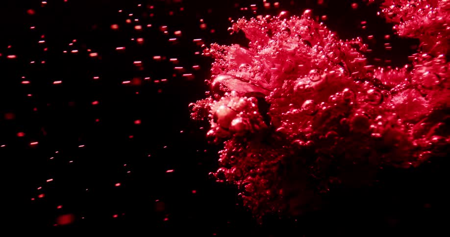 A red object is giving off red bubbles