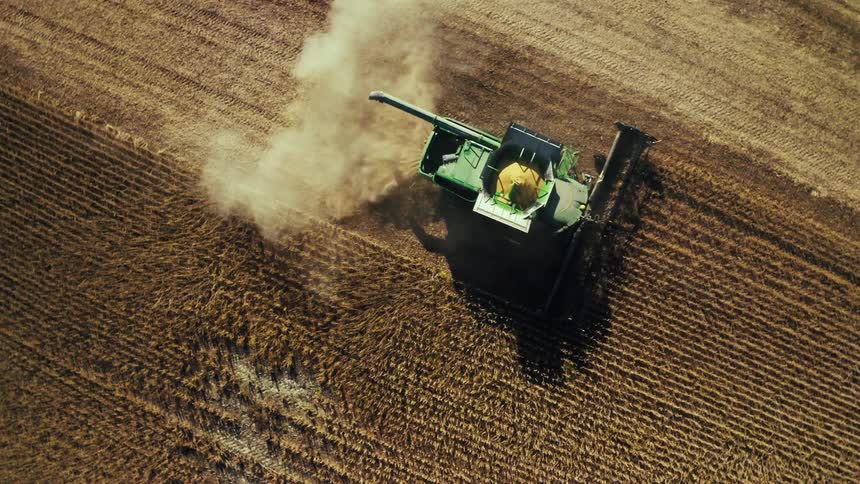 A harvester harvesting wheat on a wheat field