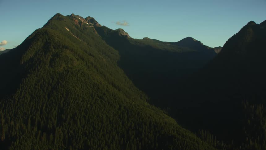 Forested mountains high in the sky