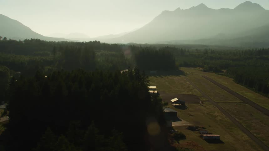A farm is in the middle of the woods