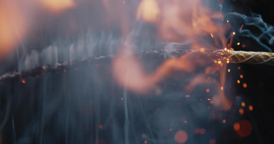 Close up of a fuse lighting up and burning