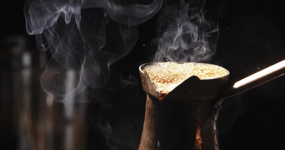 Coffee bubbling and smoking in a pot