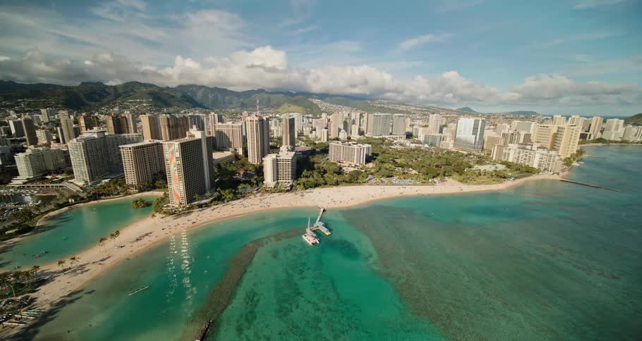 An aerial view of high rise hotels on the coast