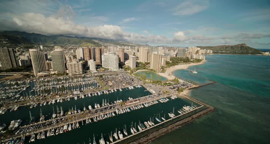 Many boats are docked by the city