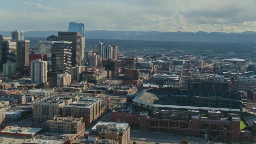Aerial view of a downtown city is displayed during midday