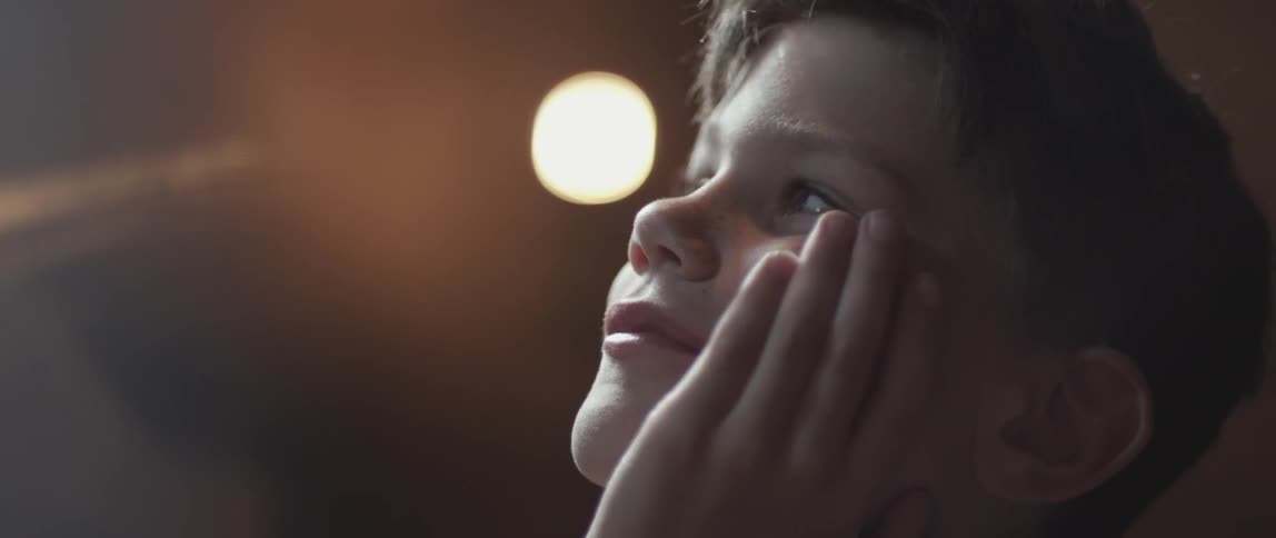 Young boy looking admiringly at something