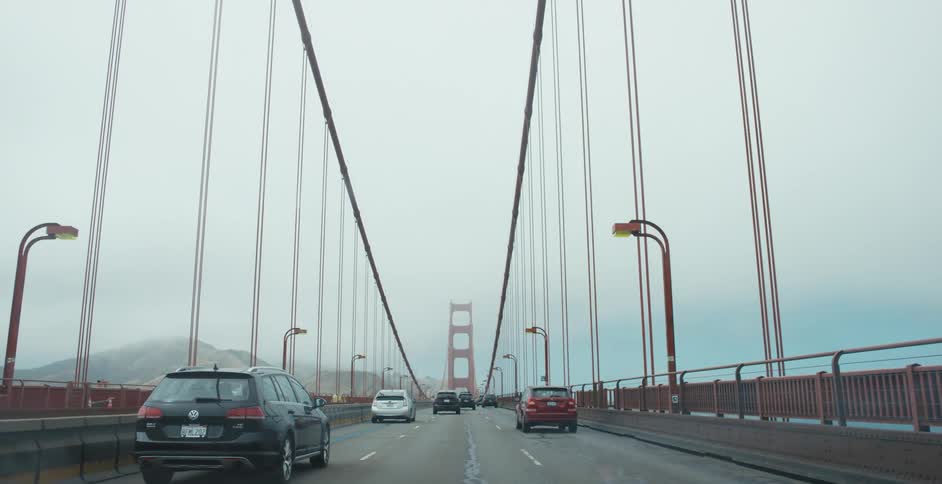 Cars driving across the Golden Gate Bridge