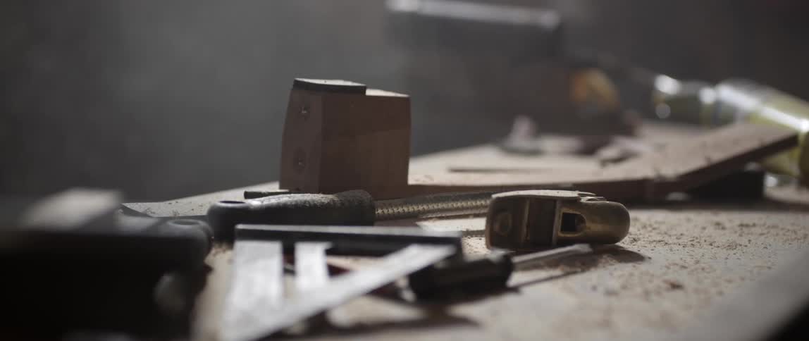 Several tools laying out on a workbench
