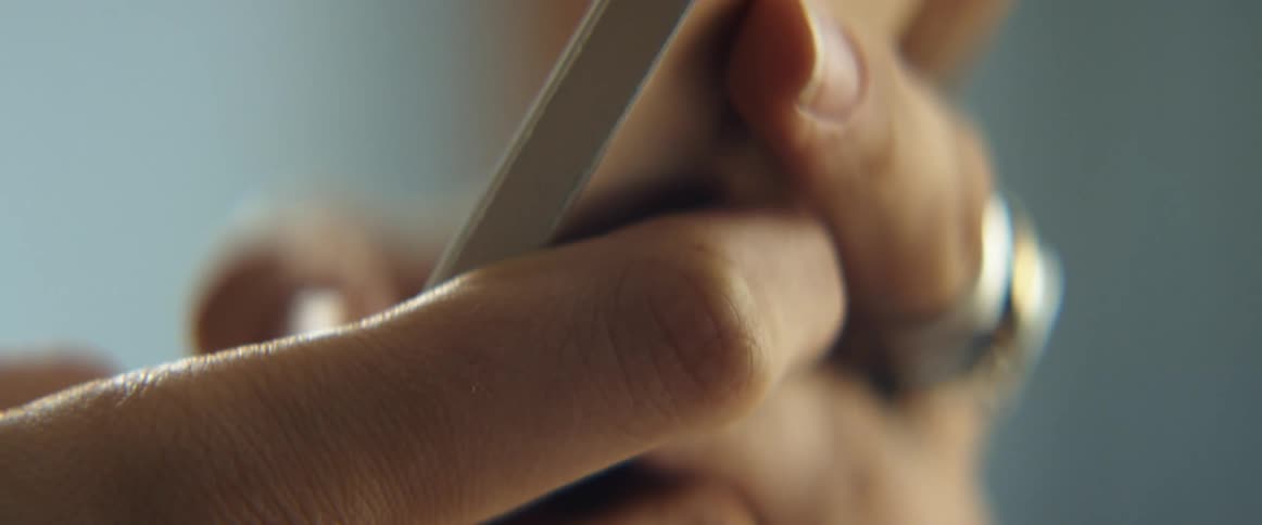 Hands holding a phone texting