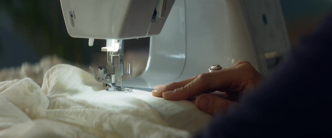 A woman using a sewing machine