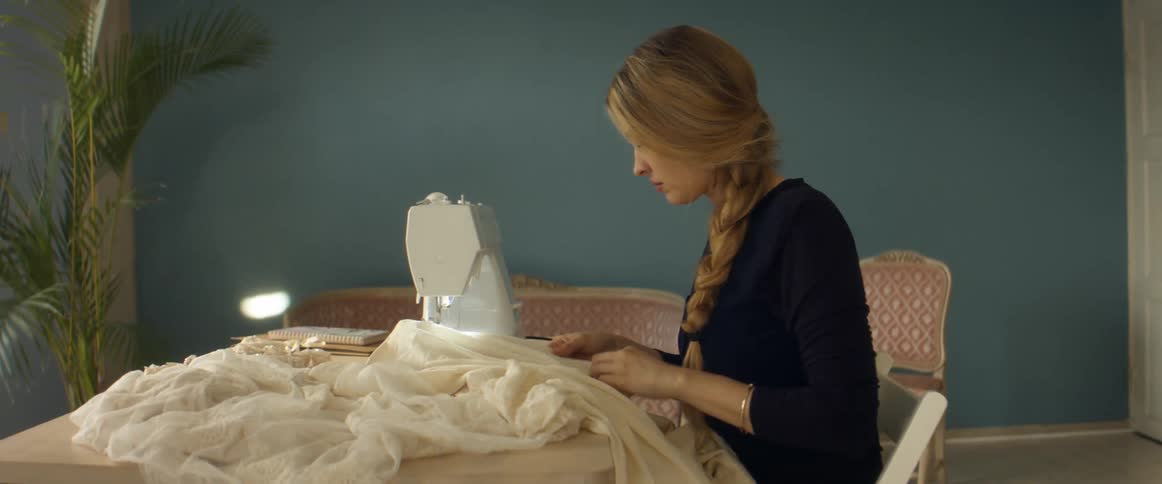 A woman using a sewing machine