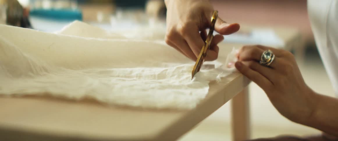 A woman working on fabric