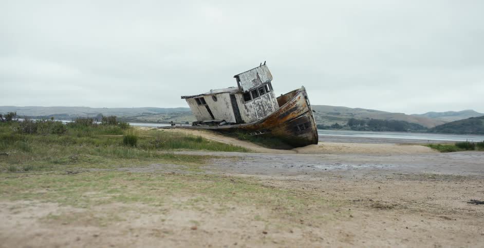 A shipwreck is on the side of the water Point Reyes, California