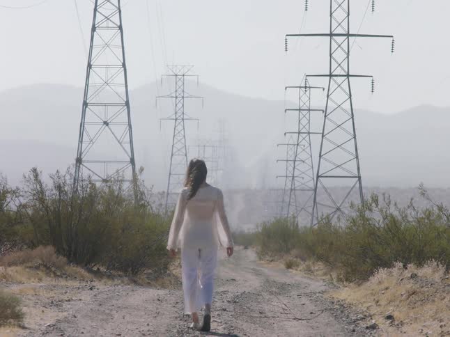 A woman walking away from the camera