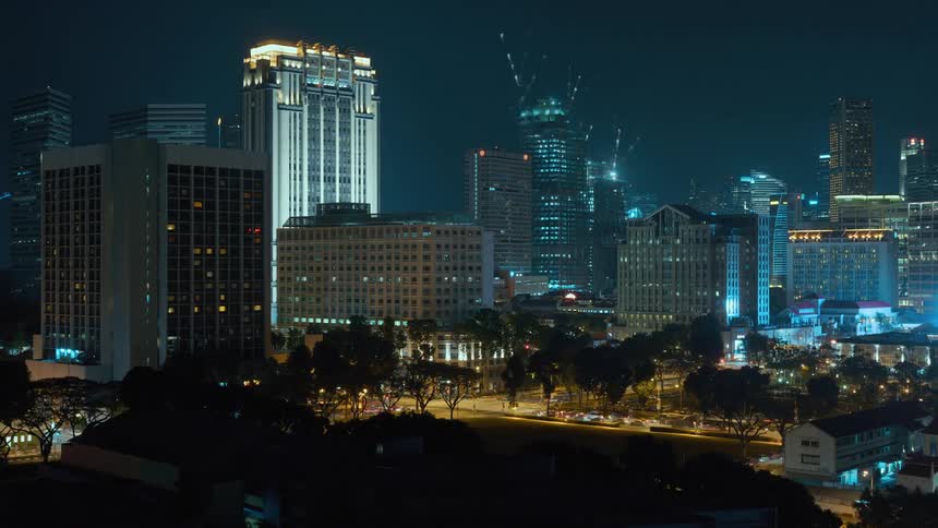 A time laps of a metropolitan city displays busy traffic and building construction