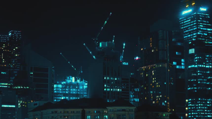 Construction crews work on a skyscraper overnight