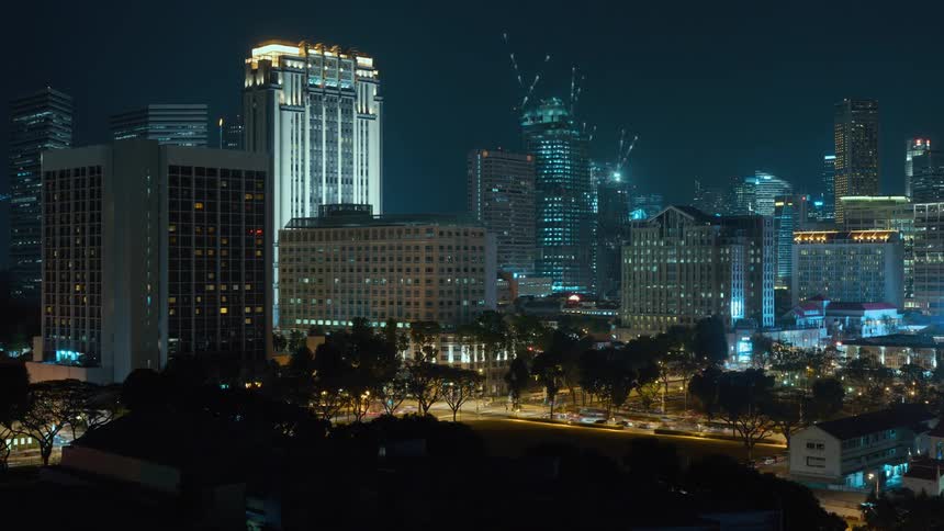 The city lights up as the traffic moves at night