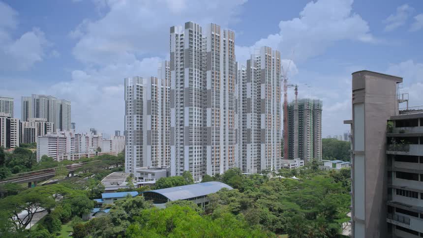 A time lapse shows a tall buildings being constructed in an urban area
