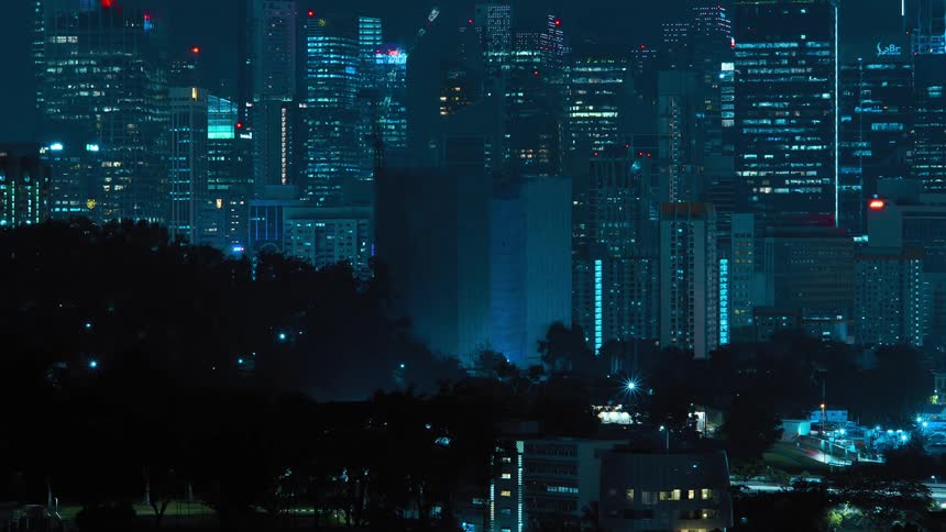 A city skyscraper shrinks and disappears as a construction crane unbuilds it