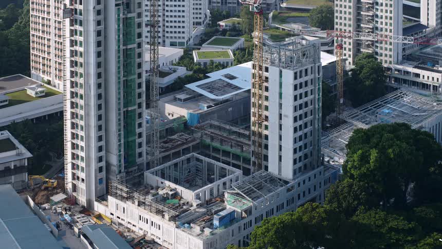 Construction workers go up in elevators operate cranes and build floor by floor until complete