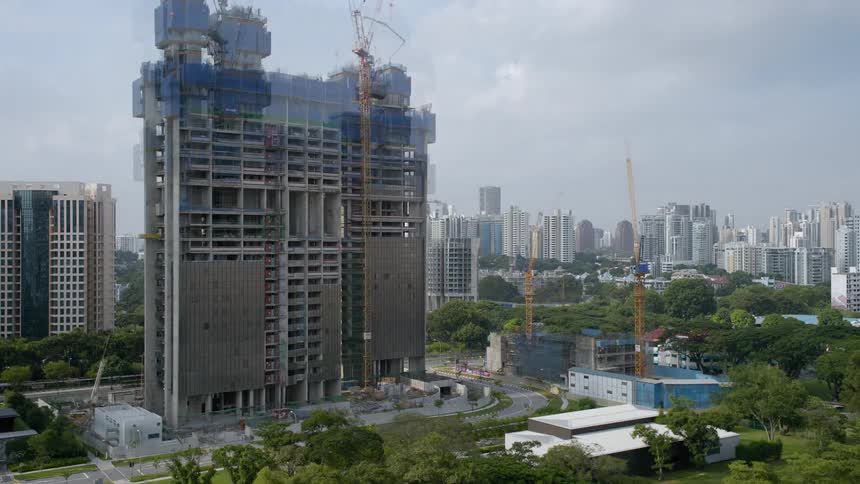 A wide high rise building goes up near downtown