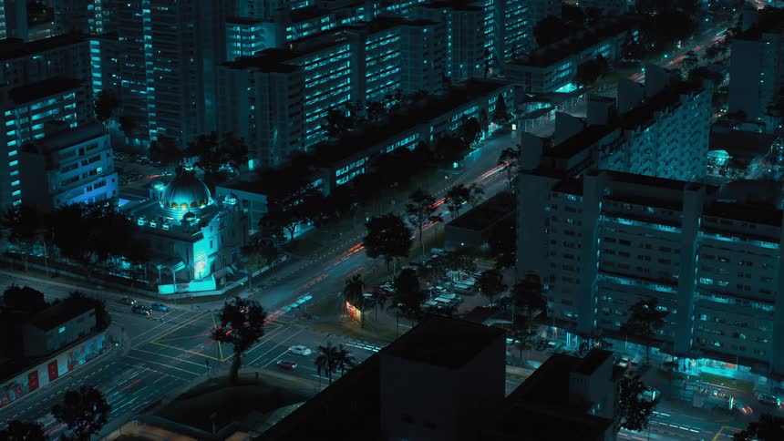 The cars travel down the road in the city