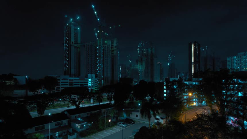 Time lapse of the construction of a building in the citys downtown at night