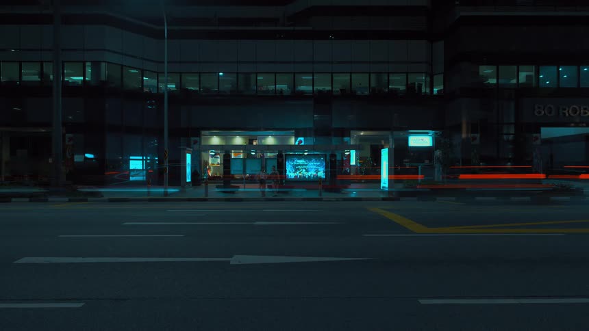 A city street with vehicles with buildings in the background