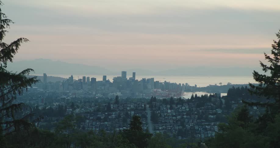 Dusk settles over Vancouver's skyline seen from a distance