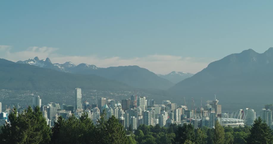 The sprawling downtown city of Vancouver is nestled between a lush forest and snow capped mountains