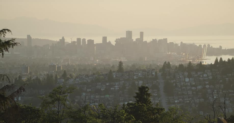 Vancouver city skyline seen from a distance at sunset