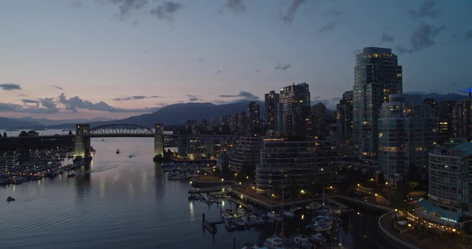 Timelapse of boats entering Vancouver's False Creek at dusk