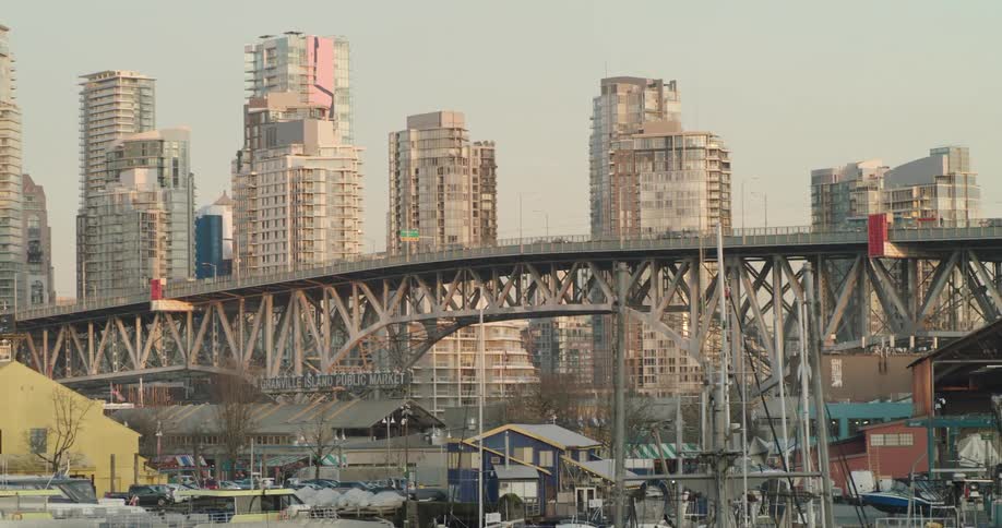 Cars driving across a bridge in a city
