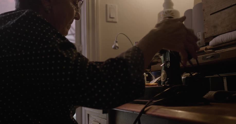 A woman is using a sewing machine
