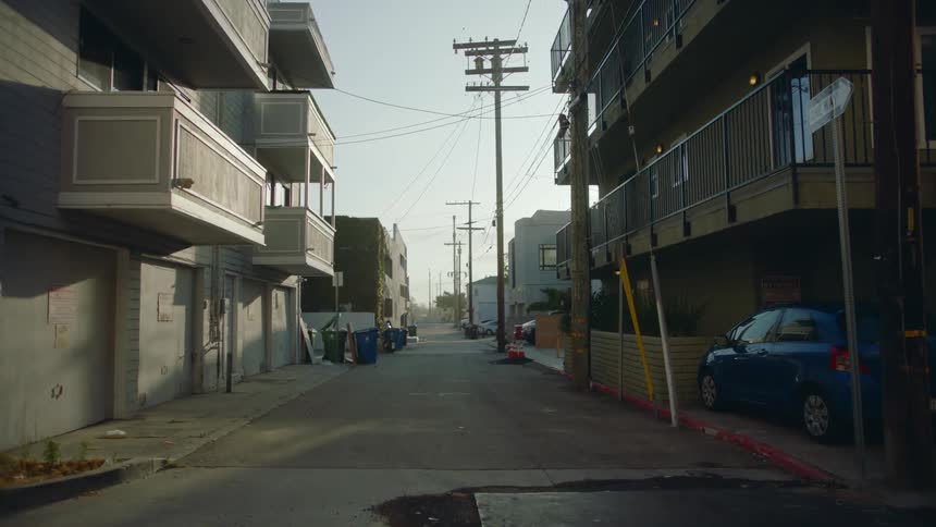 A view of buildings on an alley in a city