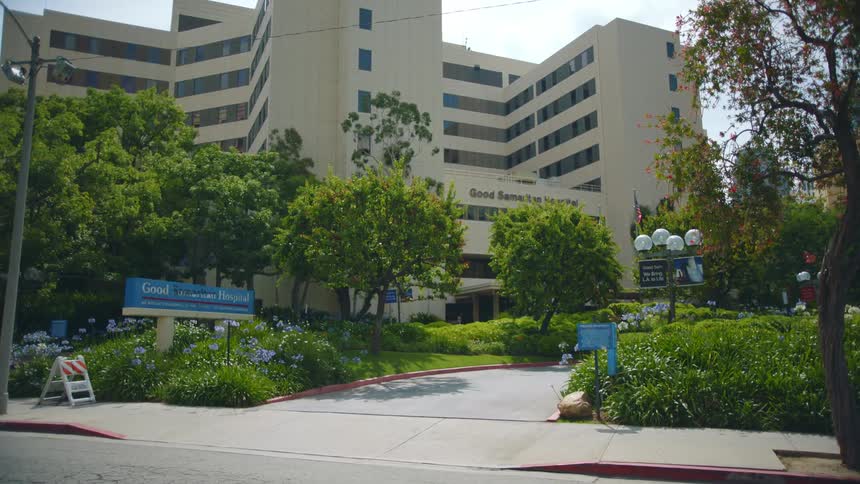 Multiple signs direct guests to a sprawling hospital complex