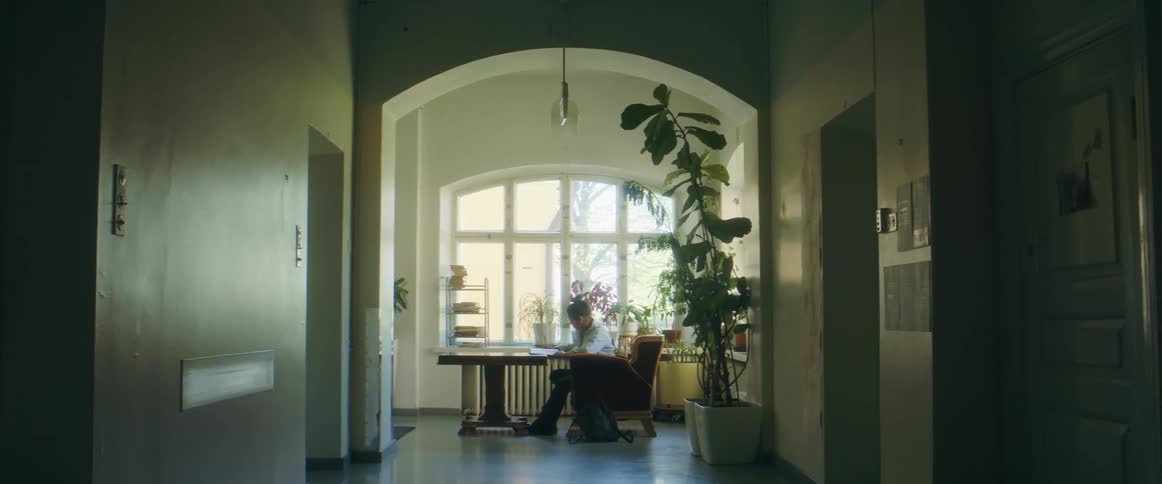 A man sitting at a table and reading