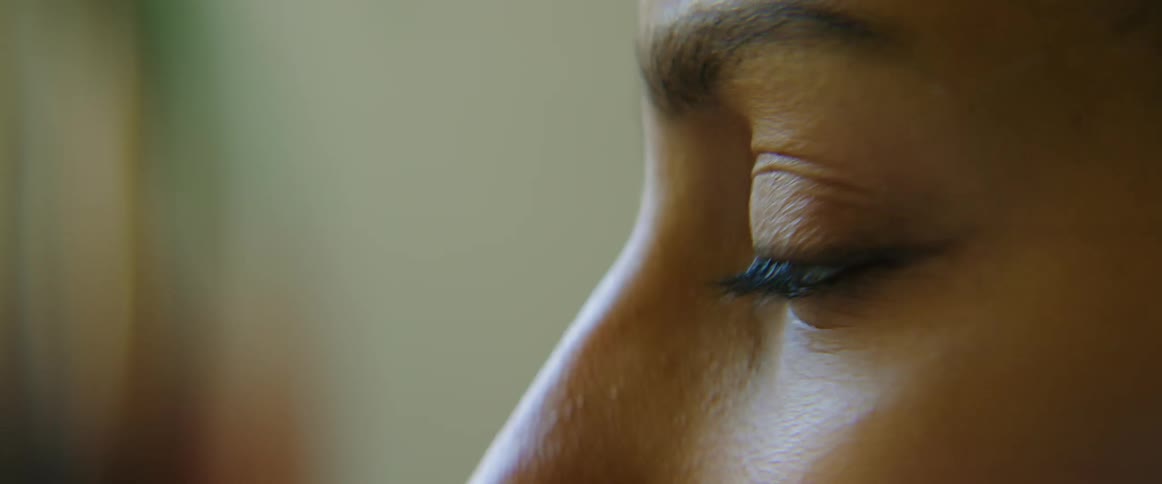 A close up view of a womans face is displayed
