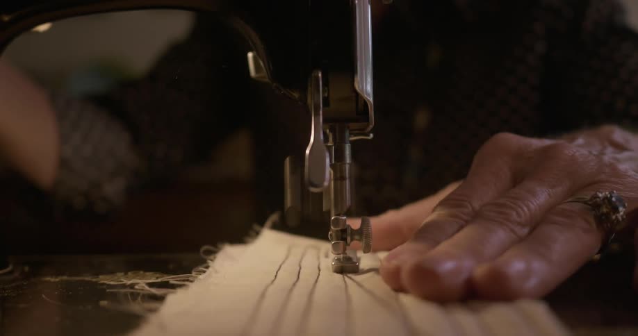 A person is using a sewing machine