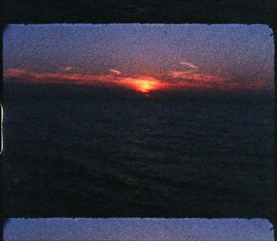 Gentle waves on the ocean at sunset