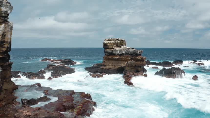 Waves hitting against rocks