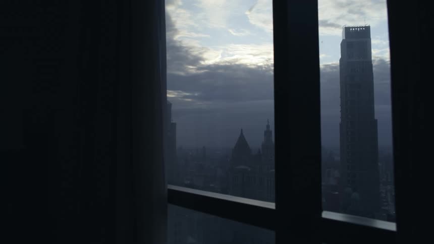 Tall windows in a building have a clear view of downtown New York City
