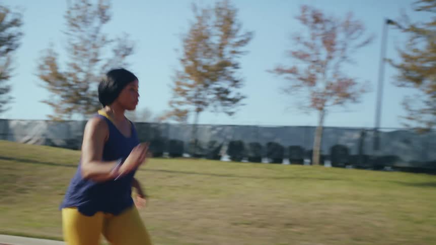 A woman running on a track